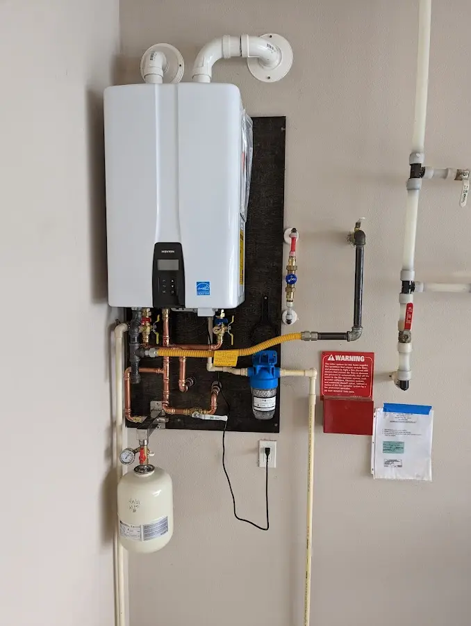 Professional plumber installing copper piping in a Lemon Hill home